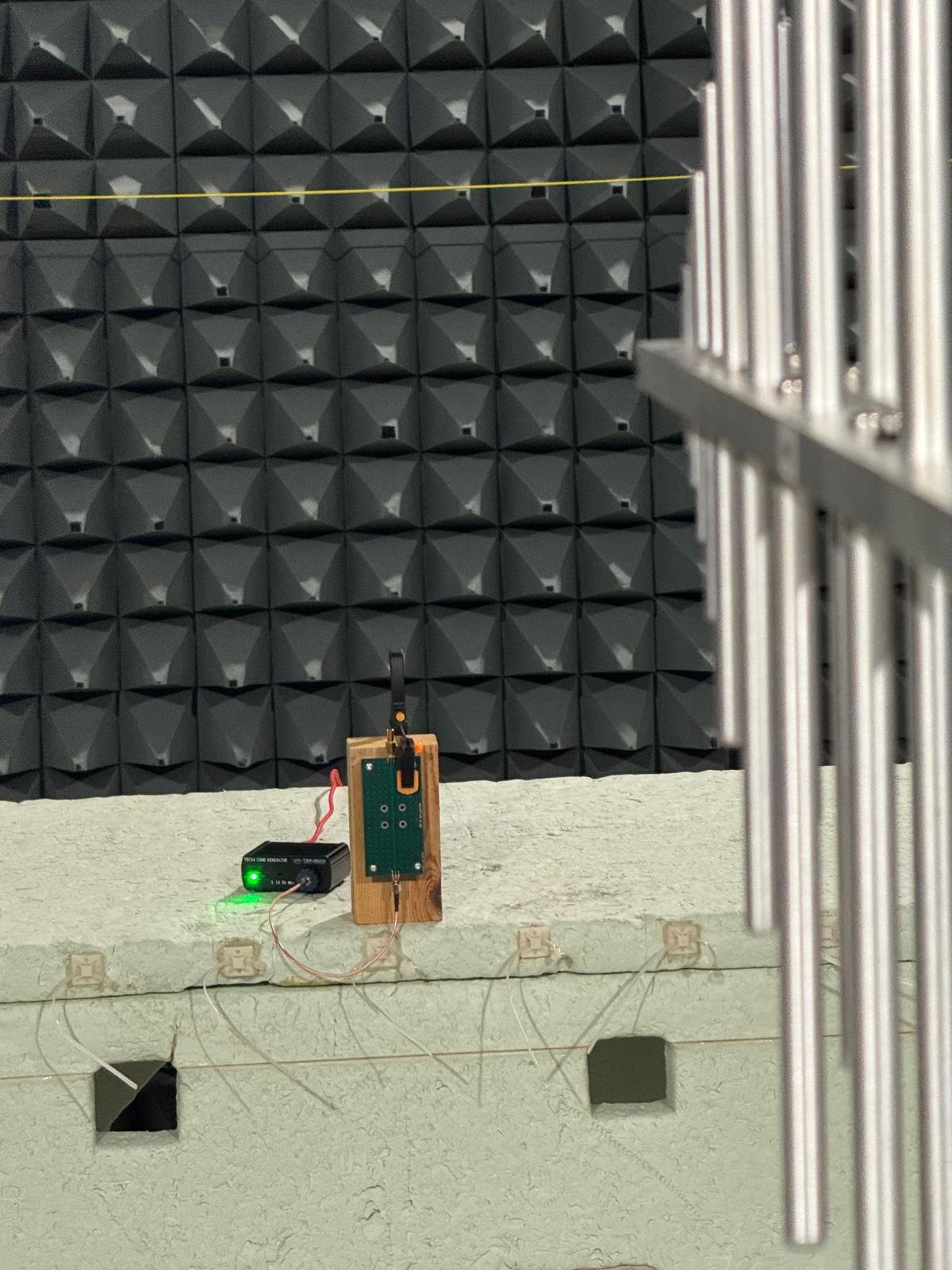 Test setup: PCB on a wooden block in the FAR, comb generator feeding the SMA