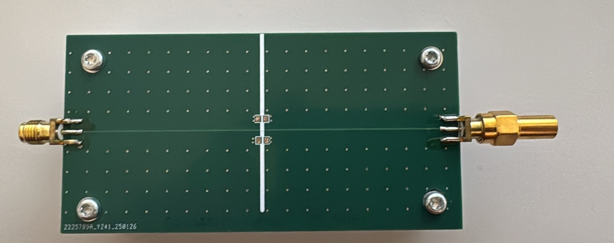 Fabricated split board with visible ground plane gap and stitching cap pads