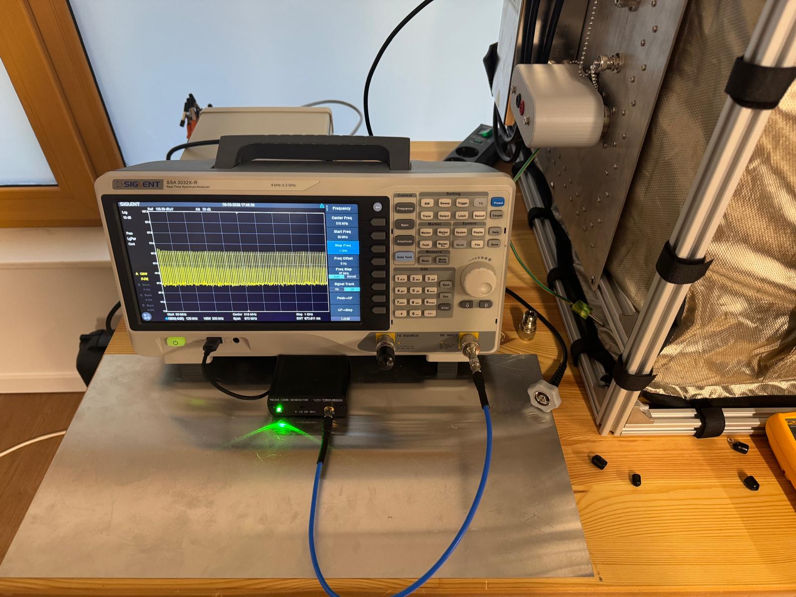 Comb generator connected to spectrum analyzer with 10 dB attenuator